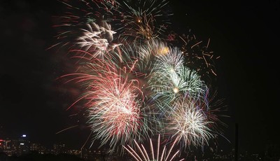 
              Fireworks explode in the sky above Sydney Harbour during the pre New Years Eve celebrations in Sydney, Australia, Monday, Dec. 31, 2012.(AP Photo/Rob Griffith)
            